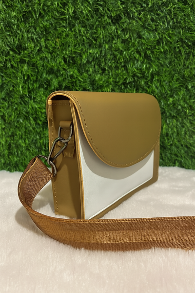 A prominent, circular gold-toned metal closure Handbag for Ladies/